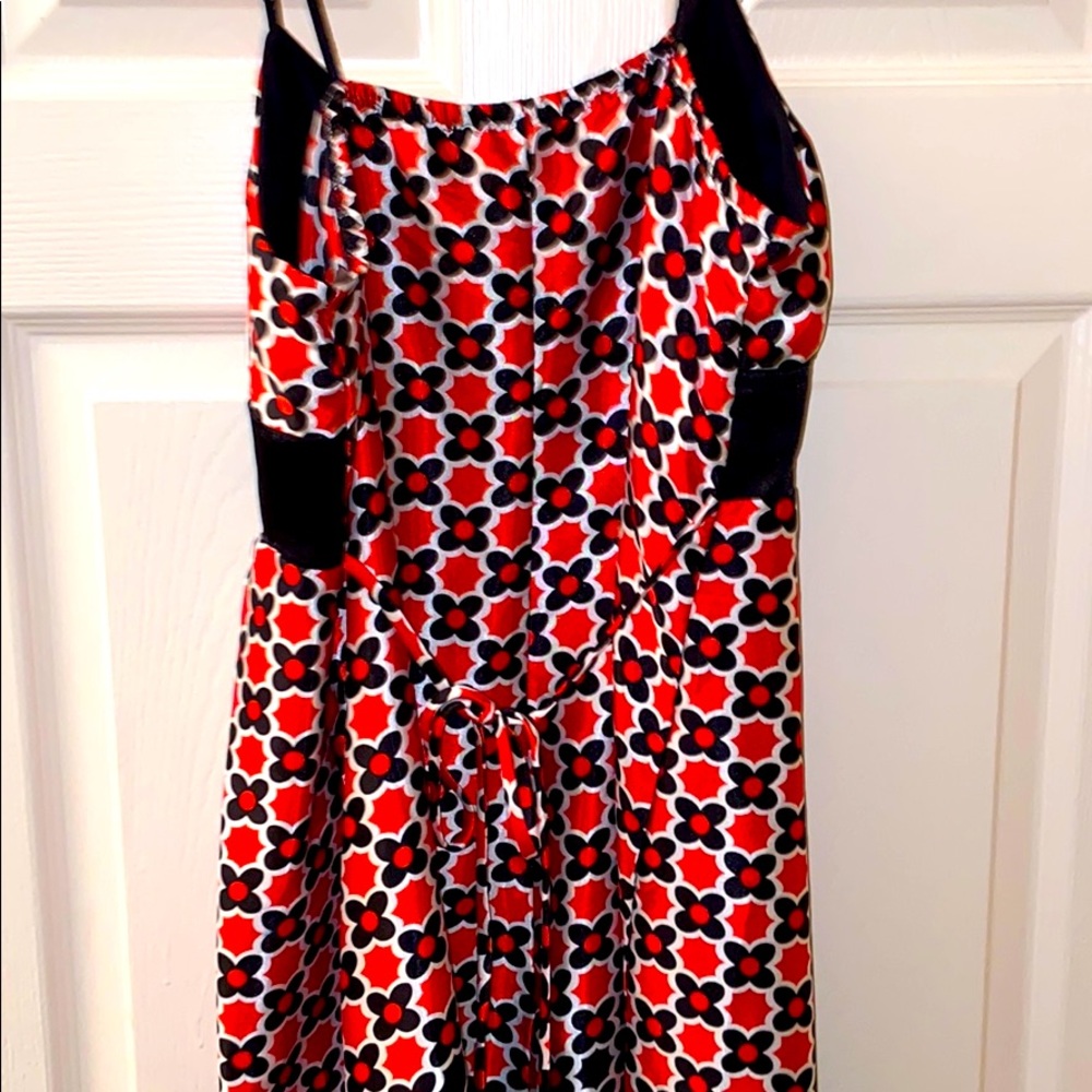 Satin sundress with red and black flowers and black sash